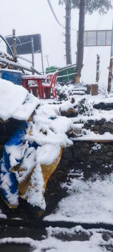 a pile of snow on a snow covered sidewalk at Rara Sunrise Hotel in Chautha