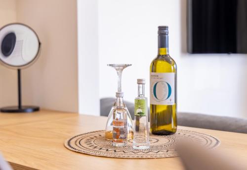 two bottles of wine sitting on top of a table at Enalis Studios & Apartments in Karfas