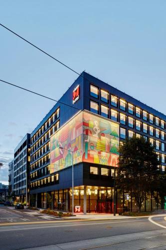 a building with a painting on the side of it at citizenM Seattle South Lake in Seattle
