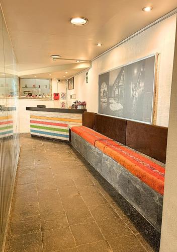 a waiting room with a bench in a train station at Wakapunku Boutique B&B in Cusco