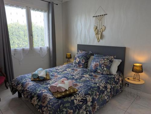 a bedroom with a bed with two baskets on it at Gite De La Meronne in Vindelle