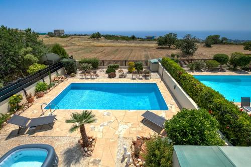 an overhead view of a swimming pool on a balcony at Seaview Villa in Peyia | Private pool & jacuzzi by VICHY Holidays in Paphos