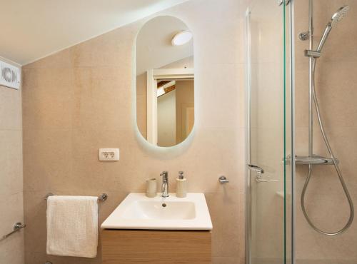 a bathroom with a sink and a shower at Villa Jele in Dubrovnik