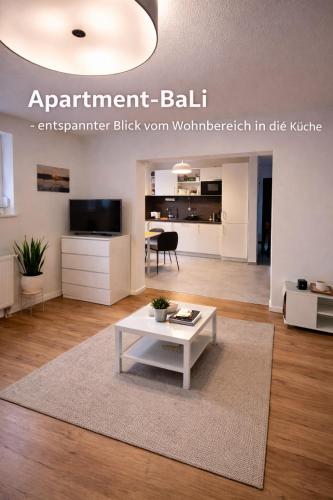 a living room with a white coffee table in a room at Apartment_BaLi in Linkenheim-Hochstetten