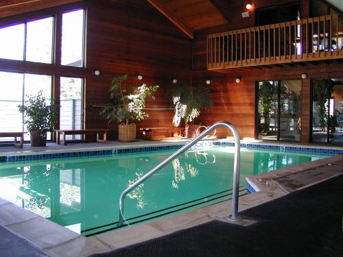 a swimming pool with a hand rail in a house at The Village at Steamboat in Steamboat Springs