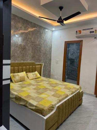 a bedroom with a bed with a checkeredkered at Aanya Bnb in Zirakpur