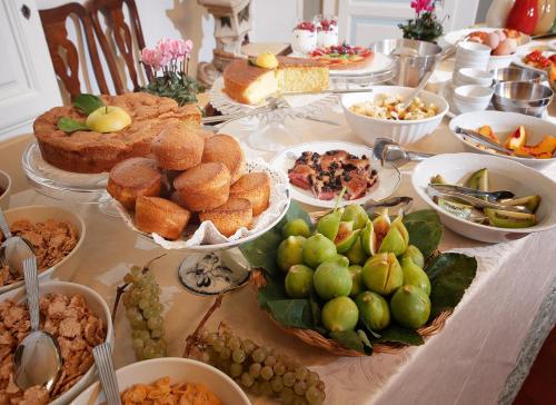 a table topped with lots of different types of food at Badia a Coltibuono Wine Resort in Gaiole in Chianti