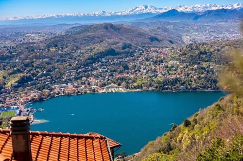 a view of a lake with mountains in the background at Locanda Milano 1873 in Brunate