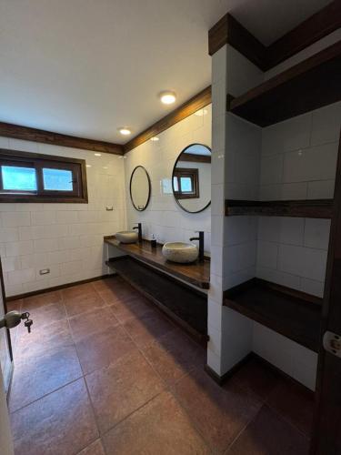 a bathroom with a sink and a mirror at Casa Mayay in Ranco