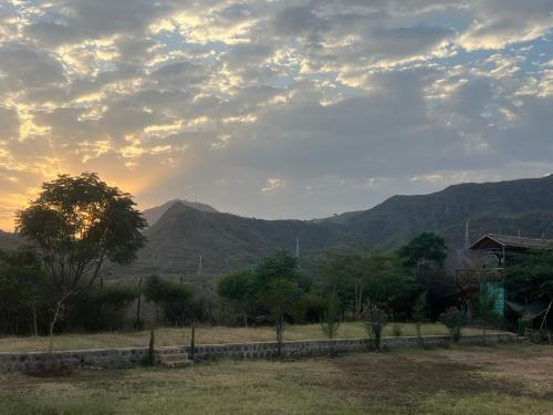 a view of a field with mountains in the background at Arbaminch eco campsite and lodge in Ārba Minchʼ