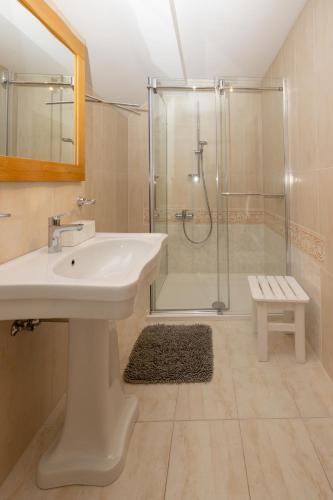 a bathroom with a sink and a shower at Rooms Hrominc in Bled