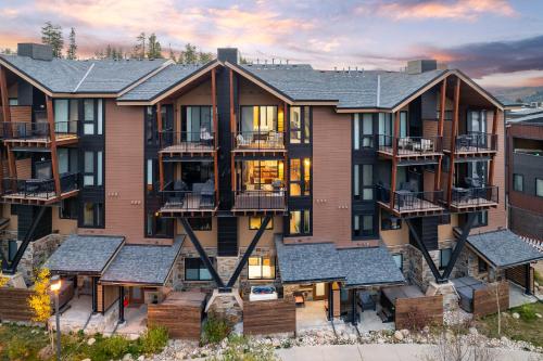 an aerial view of a large apartment building with balconies at Downtown WP River Front Villa 242 I Private Hot Tub I Great Views in Winter Park