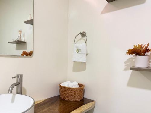 a bathroom with a sink and a towel rack at Casa Boho in Quesada