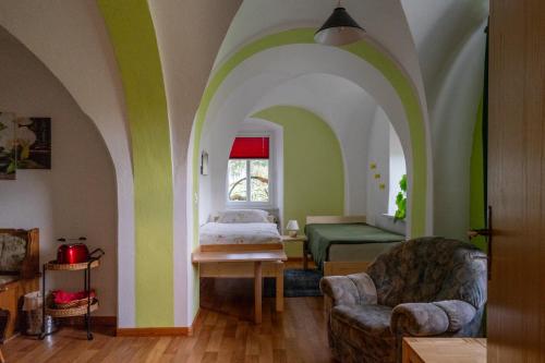 a bedroom with green and white walls and a bed at Ferienwohnung Reichel in Remptendorf