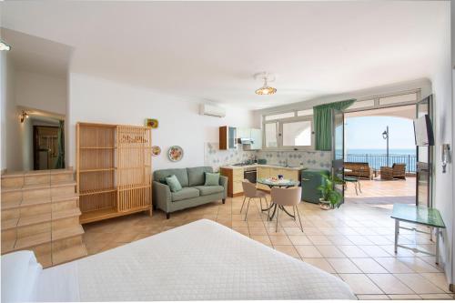 a living room with a couch and a table at Casa Marina in Praiano