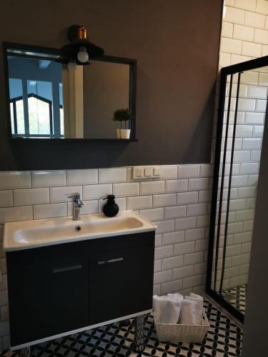 a bathroom with a sink and a mirror at Villa Rüzgar in Dalaman