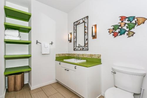 a bathroom with a sink and a mirror at 477 Fort Pickens Rd. in Pensacola Beach