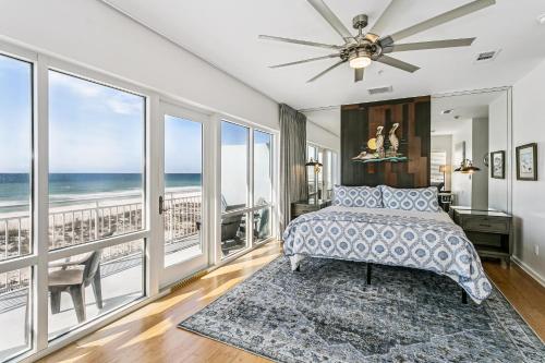a bedroom with a bed and views of the ocean at 477 Fort Pickens Rd. in Pensacola Beach