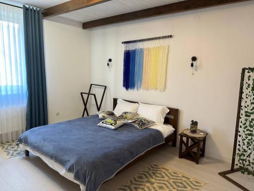 a bedroom with a bed with two pillows on it at Майдан house in Maidan Village