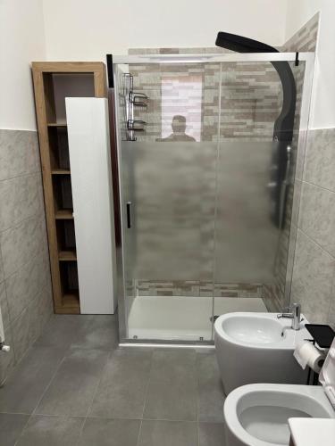 a bathroom with a shower and a toilet and a sink at Dayana House in Gallipoli