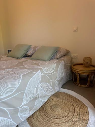 a bed with two pillows on it in a bedroom at Studio confortable central in La Roche-sur-Yon