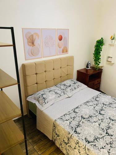 a bedroom with a bed in a room at Jesaluguel-de-casa in Cabo Frio