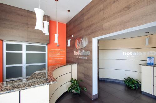 a lobby of a hospital with a door and aostics at Hotel Hi! Zapopan in Guadalajara