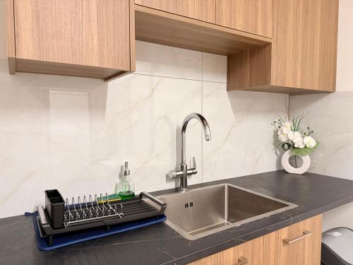 a kitchen counter with a sink and a sinkiterator at Nicosia Neoclassic Retreat in Nicosia