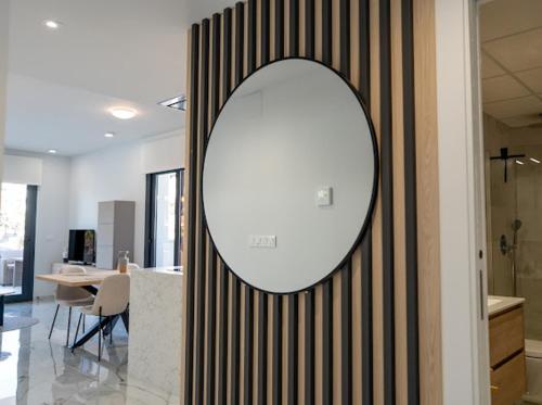 a large mirror on a wall in a room at Casa Lauri in Orihuela Costa
