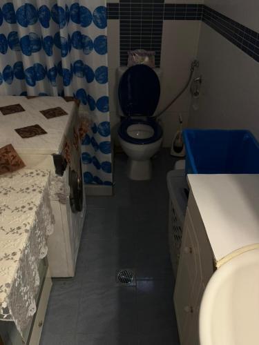 a bathroom with a toilet and a sink at Vila PANORAMA in Karianí