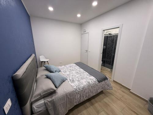 a bedroom with a large bed and a window at Soft landing at home in CTA