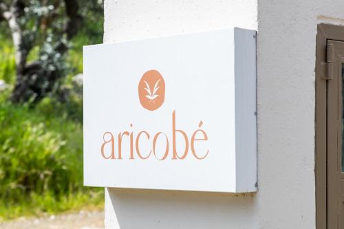 a sign for anacco on the side of a building at Aricobé in Ancient Epidauros