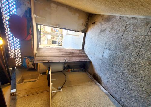 a small room with a window in a building at maison individuelle in Le Grau-du-Roi