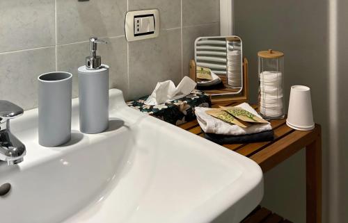 a bathroom with a sink and a counter with towels at B&B Il Picchio in Mergozzo