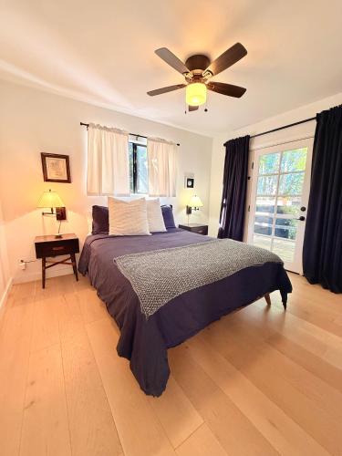 a bedroom with a bed and a ceiling fan at Charming Private Cottage in Ojai in Ojai