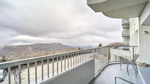 a balcony with a chair and a view of a mountain at 3 Mi to Skiing Mtn-View Condo in Sugar Top Resort in Sugar Mountain