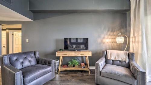 a living room with two leather chairs and a tv at 3 Mi to Skiing Mtn-View Condo in Sugar Top Resort in Sugar Mountain