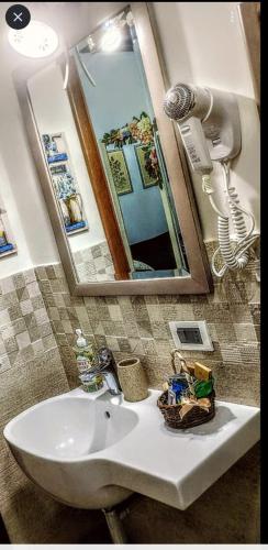 a bathroom with a sink and a mirror at Mare Incanto in Gragnano