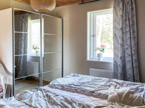 a bedroom with a bed and a window at 4 person holiday home in KLINTEHAMN-By Traum in Klintehamn