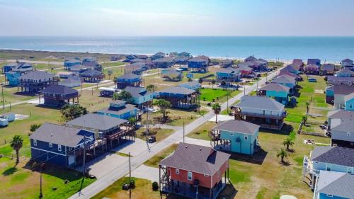 an aerial view of a neighborhood with houses and the ocean at Hannah Cabana home in Crystal Beach