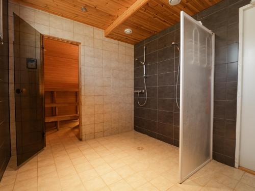 a bathroom with a shower and a walk in shower at Eistvere Puhkemaja in Eistvere