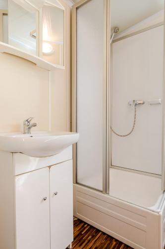 a bathroom with a sink and a shower at Relax Camping Seewirt in Feldkirchen in Kärnten