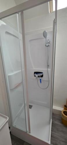 a white refrigerator with its door open in a kitchen at Appartement Pierre in Mers-les-Bains