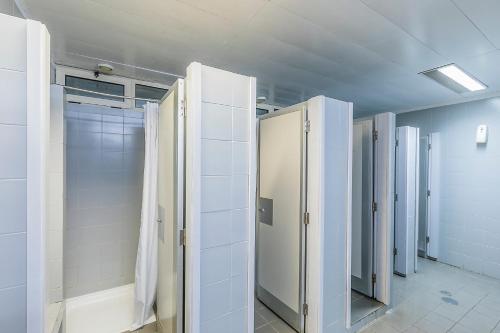 a row of stalls in a bathroom at HI Porto - Pousada de Juventude in Porto
