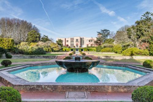 a fountain in the middle of a garden at HI Porto - Pousada de Juventude in Porto