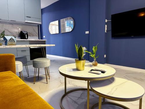 a living room with a yellow couch and a table at Chinatown Luxury Apartment in Madrid