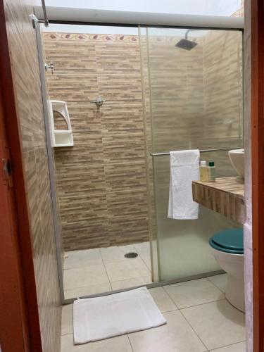 a shower with a glass door in a bathroom at Hotel San Andrés Mompox Ubicados en el Centro Histórico in Mompos