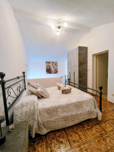 a bedroom with a large bed in a room at Alloggio DON ESTEBAN in Santa Maria della Versa