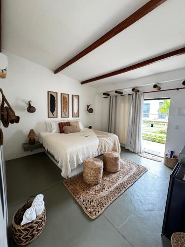 a bedroom with a bed and a large window at Francisco Jonas de Oliveira in Itapipoca
