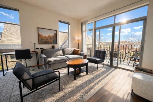 a living room with a couch and chairs at East Side Luxury 1BR Apt - Near Brady and Fiserv with Balcony - Sleeps 5 in Milwaukee